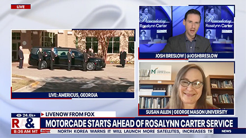 Screenshot of broadcast including image of motorcade of Rosalynn Carter along with Interviewer Josh Breslow and Susan Allen